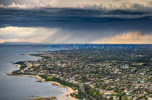 aerial photographs of melbourne Australia and suburbs, on a stormy evening , with dramatic cloud formations an rain.