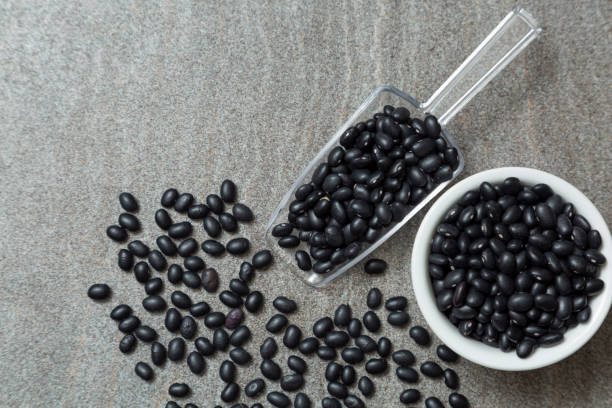 istock black bean in plastic spoon and white bowl 1357801130
