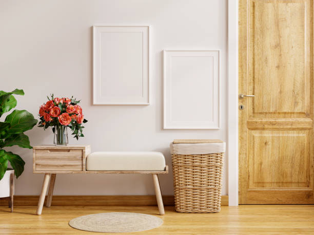 istock Mock up frame poster on wall and door storage bench with cream colored wall. 1357802056