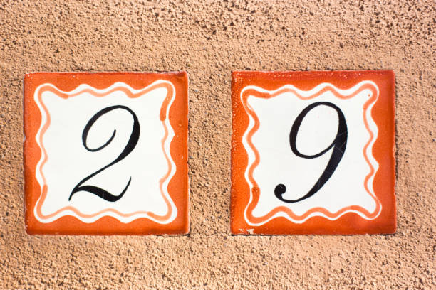 istock Ceramic Number 29 Street Address Tiles; Brown Wall 1357802687
