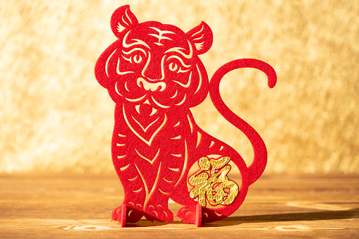 Chinese New Year Of Tiger 2022 Mascot Paper Cut On A Wood Table In The  Morning The Chinese Means Fortune No Logo No Trademark Stock Photo -  Download Image Now - iStock