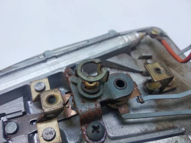 istock broken iron on white background. Close-up chipped cable. photo of damaged electronics 1357807644