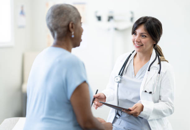 istock Doctor Talking with a Senior Patient 1357807796
