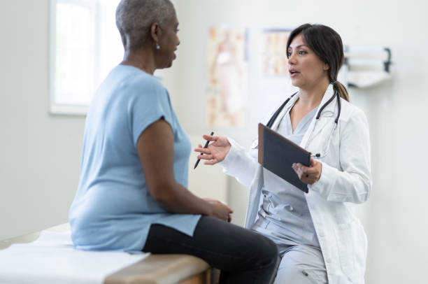 istock Doctor Talking with a Senior Patient 1357807797