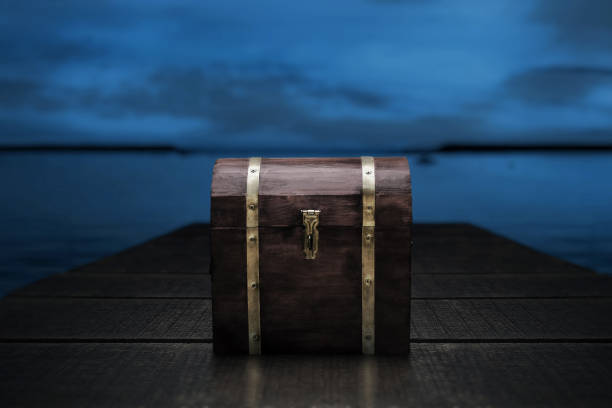 istock Wooden treasure chest on the beach 1357808681