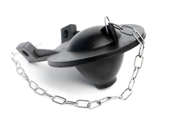 Black toilet flapper for Gravity-flush toilet tank with chain. Perspective view. Plumbing DIY. Replacement part. Flush valve seal. Fix leaking or running toilet. Isolated on white. stopper stock pictures, royalty-free photos & images