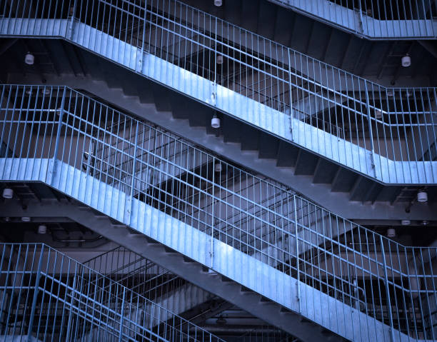 istock Blue tinted image of metal stairs 1357812068