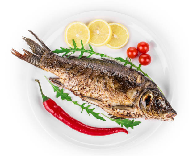 istock Grilled seabass with vegetables on a plate. 1357815148