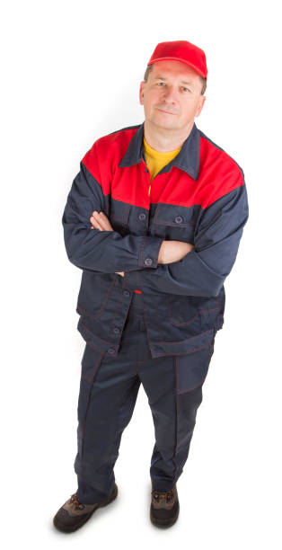 istock A worker in red and blue overalls looks up. 1357815234