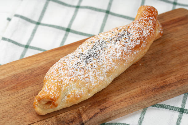 istock Traditional apple strudel on wooden board, close up 1357819660