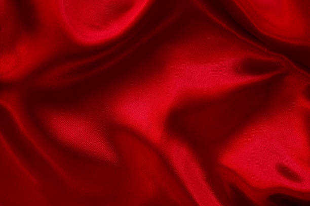 istock Dark red fabric texture background, detail of silk or linen pattern. 1357820034