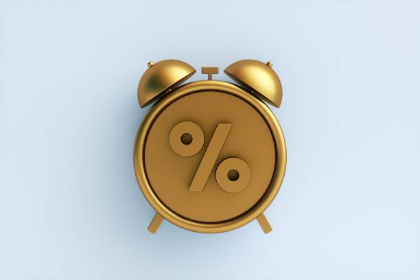 istock Golden alarm clock with percent sign on white background. 3d rendering. 1357822565