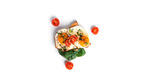 istock Toasts with eggs and vegetables isolated on white background 1357826088