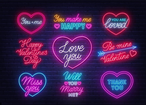 Happy Valentine's day neon quotes on brick wall background. Glowing Greeting Cards .