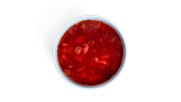 istock Red, hot borscht - beet soup isolated on a white background 1357827871