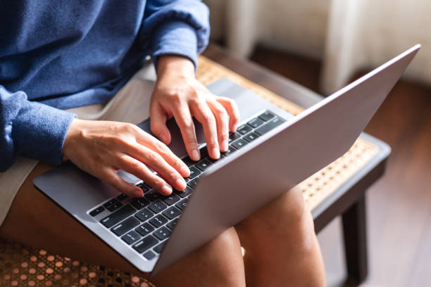 istock a woman working and typing on laptop computer keyboard 1357828508