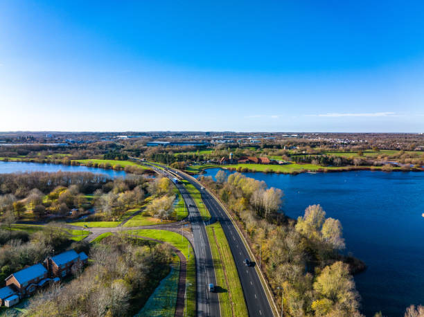 Aerial photo of the Articulated Goods Vehicle on Rural Road, Milton Keynes in the UK Aerial photo of the Articulated Goods Vehicle on Rural Road, Milton Keynes in the UK filming point of view highway day road stock pictures, royalty-free photos & images