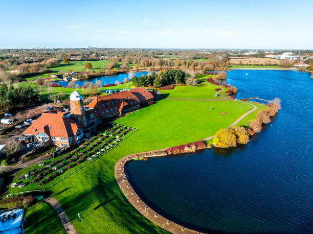 Aerial photo of the village of Milton Keynes in the UK showing a large lake Aerial photo of the village of Milton Keynes in the UK showing a large lake filming point of view highway day road stock pictures, royalty-free photos & images