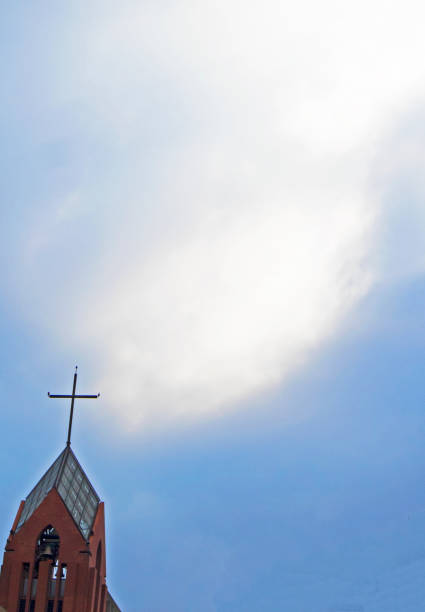 istock the cross on the church with blue sky 1357831149