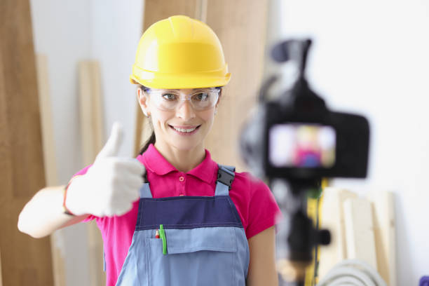 istock Happy woman construction site worker show thumbs up on camera 1357831737
