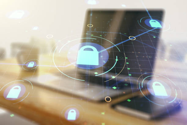 istock Double exposure of creative lock hologram with chip and modern desktop with laptop on background. Information security concept 1357837428