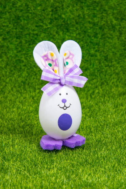 istock Easter toy bunny egg on green grass bright holiday 1357839339