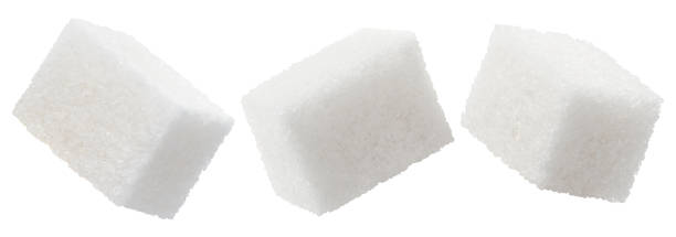 istock Set of white sugar cubes on white 1357840473