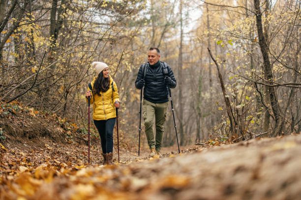 istock Confident caucasian people, keeping their body in shape by hiking. 1357840632