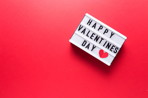 istock Box with the inscription Happy Valentine's Day on a red background 1357841852