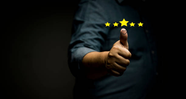 istock Customer satisfaction concept with excellent service in a positive mood Thumbs up for a positive rating of 5 stars. 1357843081