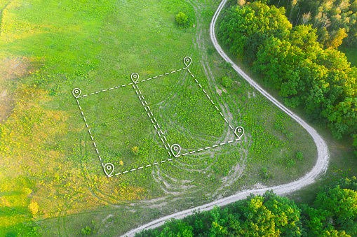 Topographical Marking of two plots of Land for Private Residence House Construction. Land Plot plan Marking. Land Plot for Housing on green field - aerial drone shot.