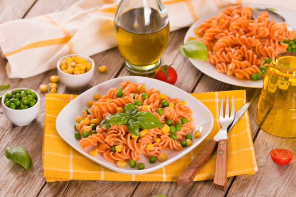 istock Fusilli pasta with peas and sweet corn. 1357844811