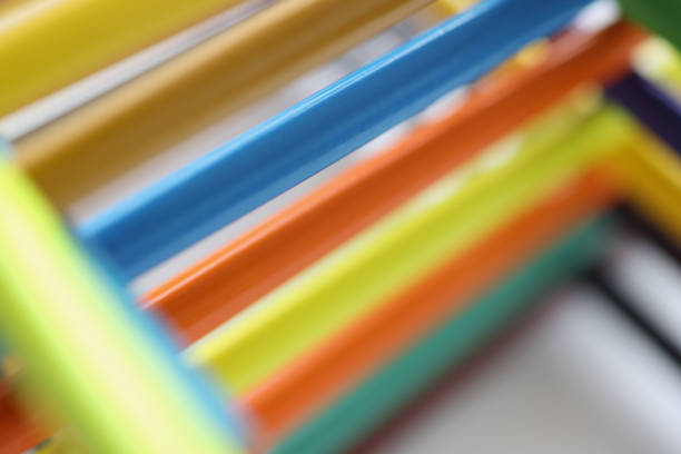 Close-up of pyramid shape made with some different colored wood pencil crayons. Tools for drawing and express your vision. Art, creativity, hobby concept