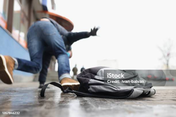 Person Get Injury After Falling On Slippery Ground In Winter Season Stock Photo - Download Image Now