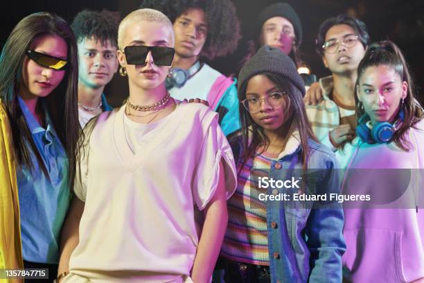 Group Of Cool Teenager Friends With Funky Style Looking To The Camera At Night After Music Video Dance Performance Party Focus On African American Girl Stock Photo - Download Image Now