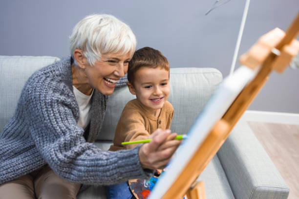 istock Grandmother spending happy time with grandson. 1357847838
