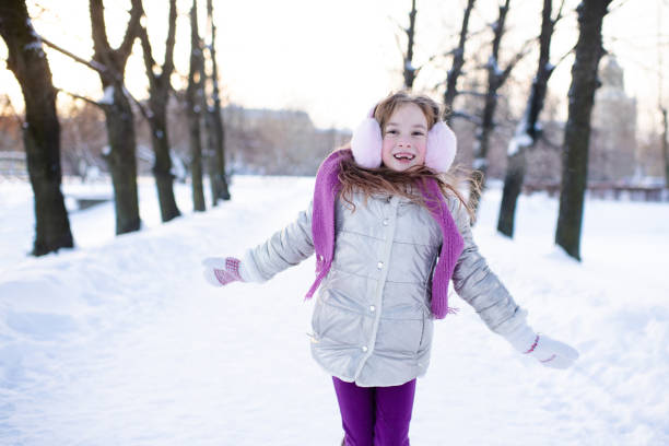 istock Cute girl over snow outdoor 1357848761