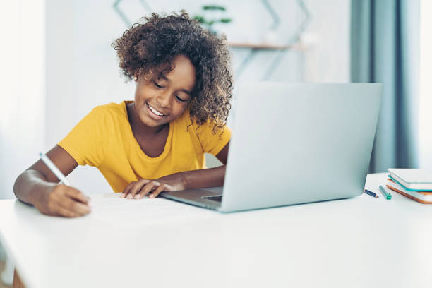 istock Schoolgirl working on her homework 1357849123