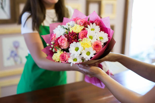 istock florist will give the client a beautiful flower bouquet 1357851468