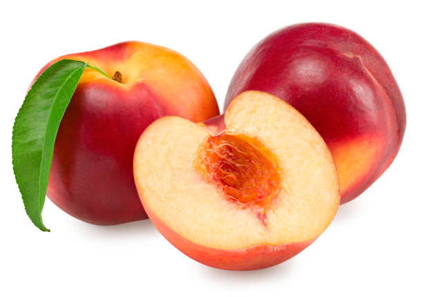 istock Nectarine with green leaf and slices isolated on white background. clipping path 1357851744