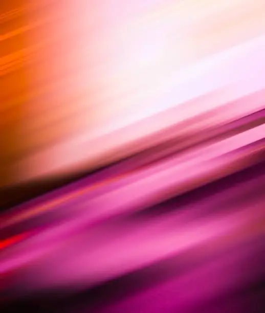 Photo of Abstract gradient orange and magenta motion blur lines colorful silk pattern texture background