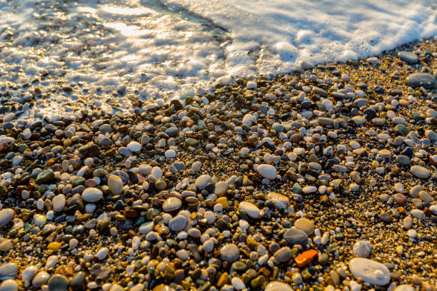 istock sea ​​water on stones pebbles on the sea 1357856565