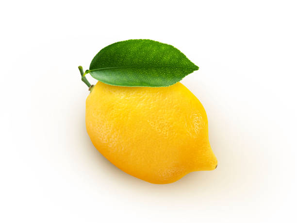 istock Closeup​ lemon​ template​ on white​ wall​ background. Yellow​ lemon​ isolated​ colors​ on white​ background. Yummy face​ of​ fresh​ lemon​ 1357856567