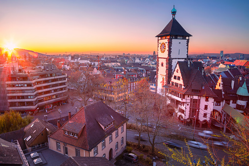 Aerial cityscape image of Freiburg im Breisgau, Germany with Swabian Gate at autumn sunset.