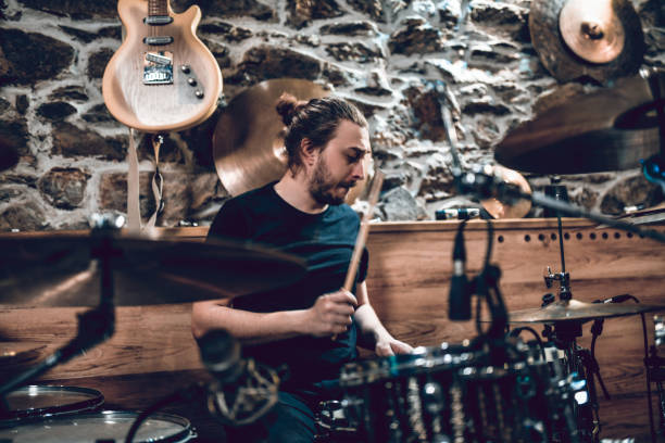 istock Bearded Drummer Owning To Kit In Studio 1357858801