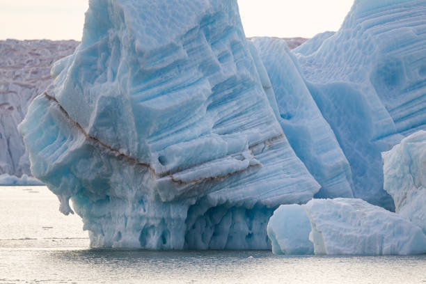 istock Broken off glacial ice floats in the arctic sea 1357860504