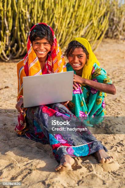 Happy Gypsy Indian Girls Using Laptop India Stock Photo - Download Image Now - Adult, Asia, Asian and Indian Ethnicities