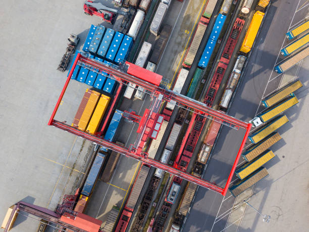 istock Cargo trains, trucks and a huge crane at railway freight terminal, Austria 1357861626