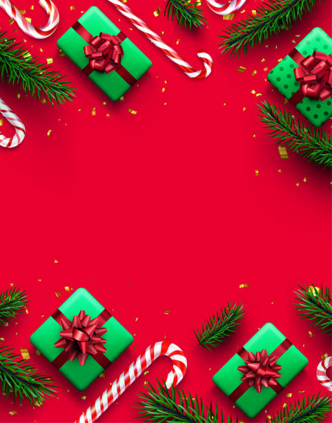 istock Red and white striped candy cane sticks with fir branches border. 1357864482