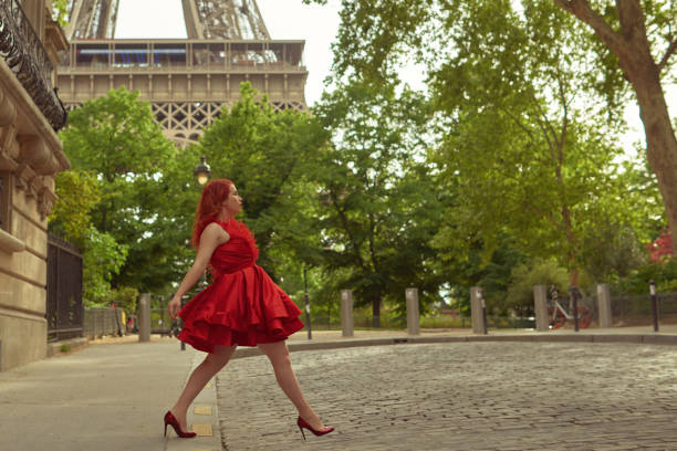 istock Elegant woman walking alone on the streets 1357865847
